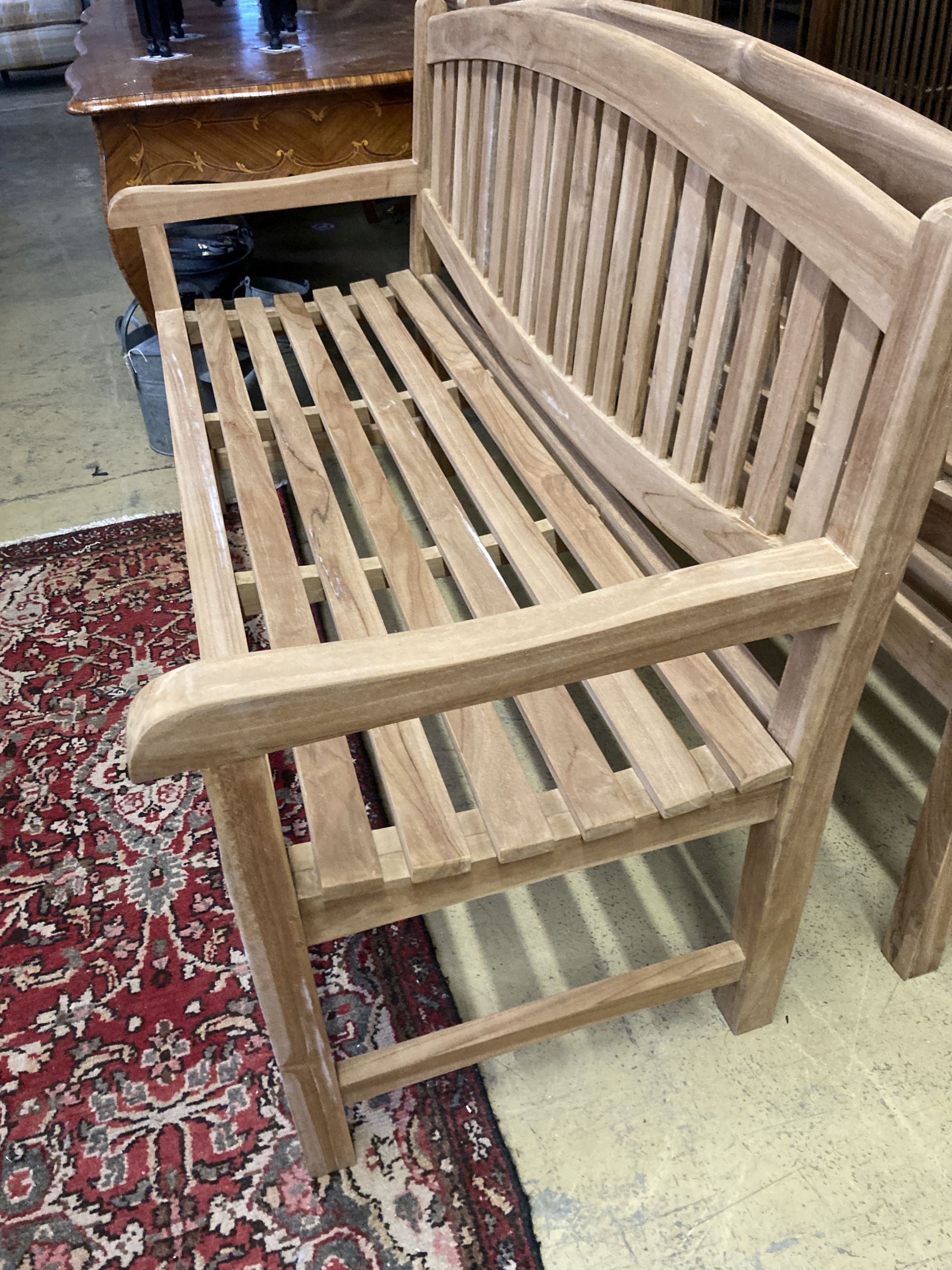 A brand new teak garden bench, length 150cm, depth 62cm, height 92cm